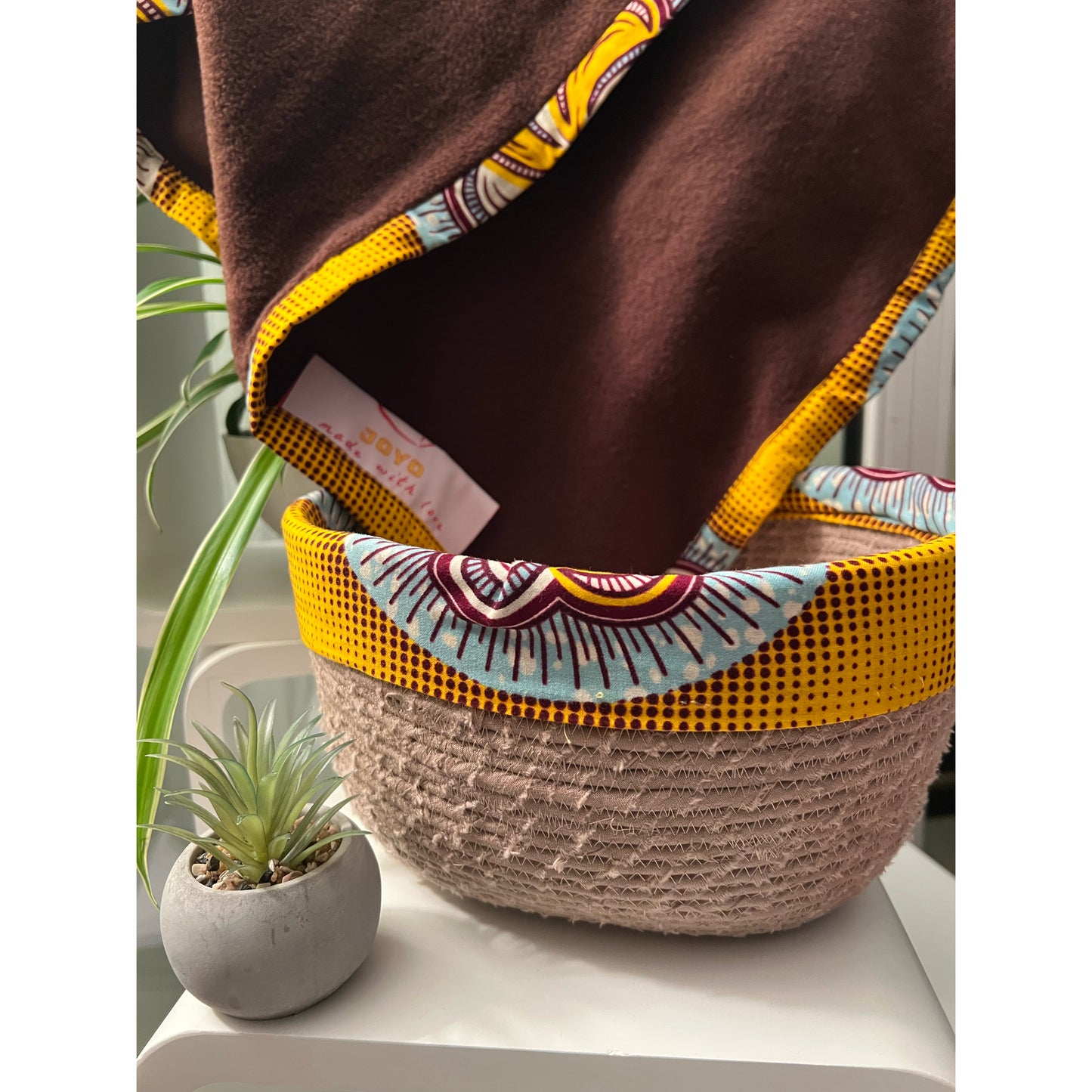 Handmade baby blanket and decorative basket set.