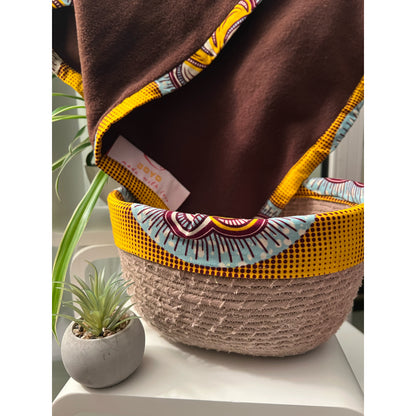 Handmade baby blanket and decorative basket set.